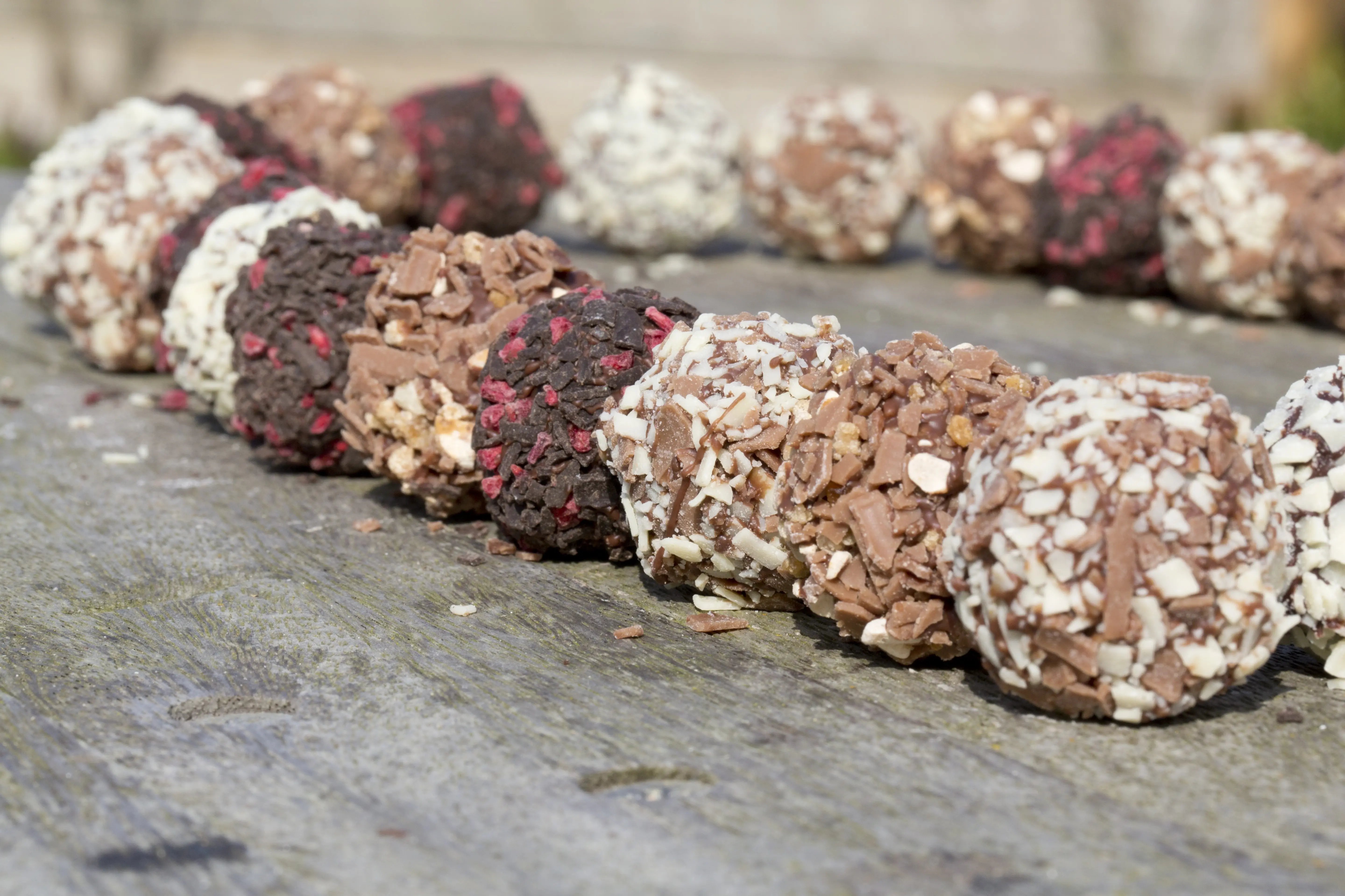 British made chocolate truffles on a wooden board