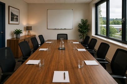 An SME boardroom with natural lighting prepared for a management meeting