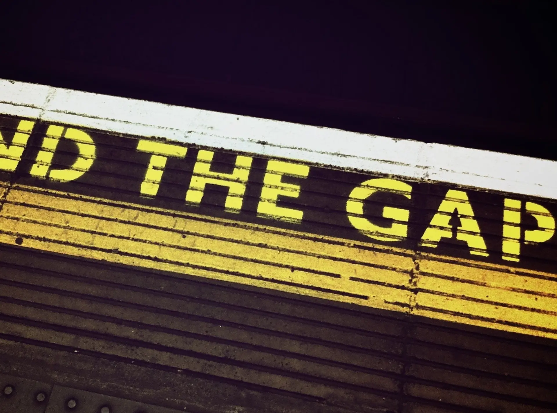Mind the gap warning sign